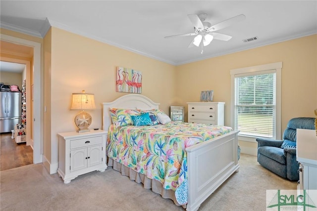 carpeted bedroom featuring crown molding, stainless steel refrigerator, and ceiling fan