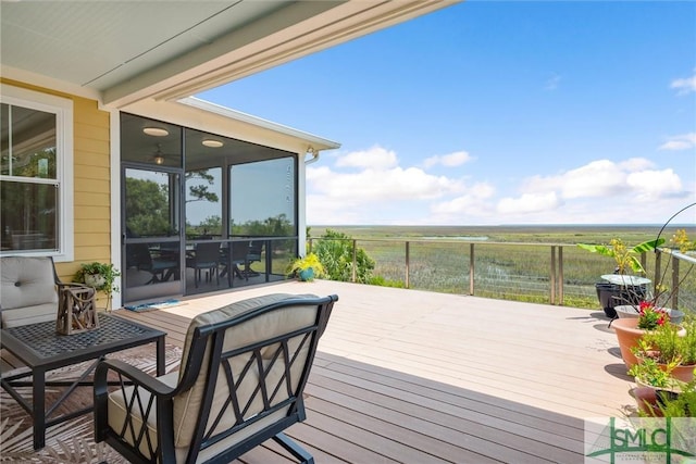 wooden deck featuring a rural view