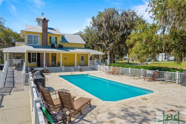 view of pool featuring a patio