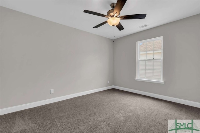 carpeted empty room featuring ceiling fan