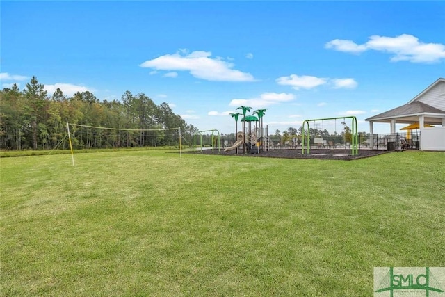 community jungle gym with a lawn and volleyball court