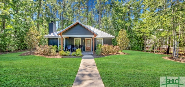 bungalow-style house with a front lawn and covered porch