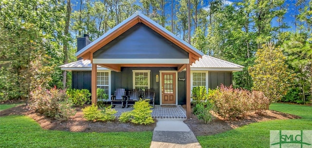 bungalow-style house with a front yard and a porch