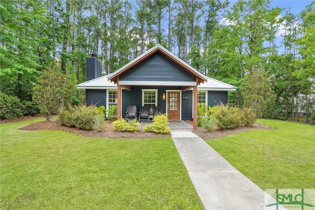 bungalow-style house with a front yard and a porch