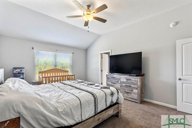 carpeted bedroom with a textured ceiling, lofted ceiling, and ceiling fan