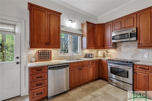 kitchen featuring tasteful backsplash, sink, and stainless steel appliances