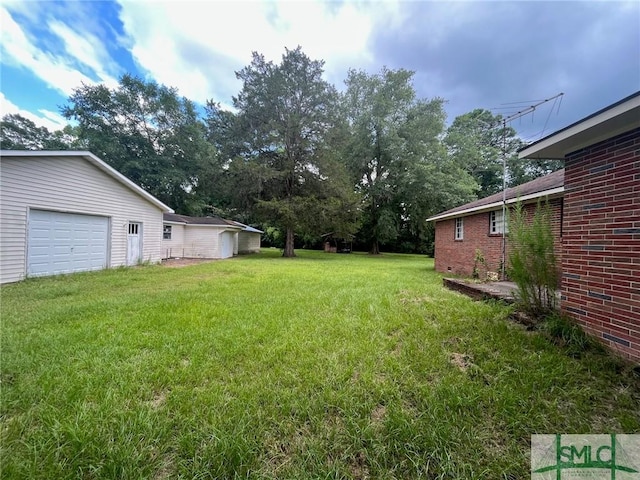 view of yard with a garage