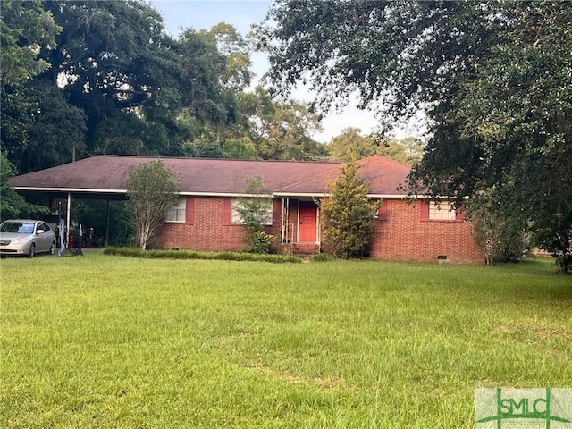 ranch-style home featuring a front yard and a carport