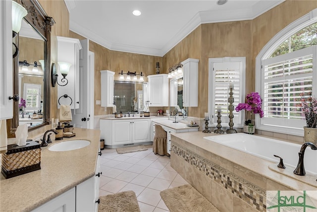 bathroom with tile flooring, tiled bath, ornamental molding, and vanity