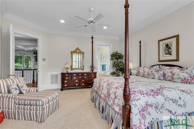 carpeted bedroom featuring ornamental molding, ceiling fan, and multiple windows