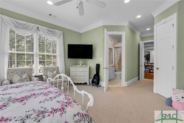 bedroom featuring crown molding, carpet floors, connected bathroom, and ceiling fan