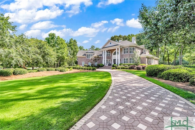 view of front of home with a front lawn