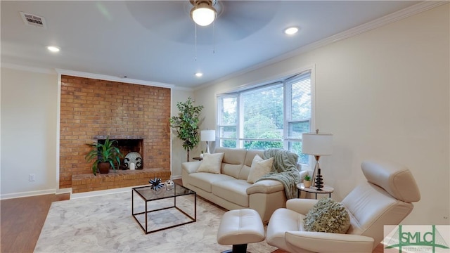 living area featuring ornamental molding, a fireplace, wood finished floors, and baseboards