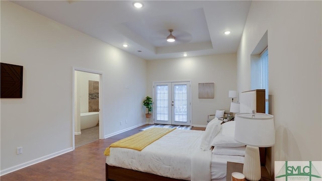 bedroom featuring access to outside, french doors, a raised ceiling, and recessed lighting