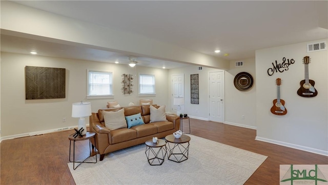 living area featuring recessed lighting, visible vents, baseboards, and wood finished floors