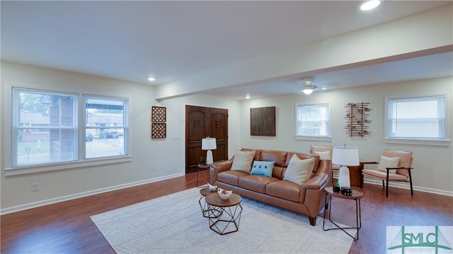 living room featuring recessed lighting, light wood-type flooring, and baseboards