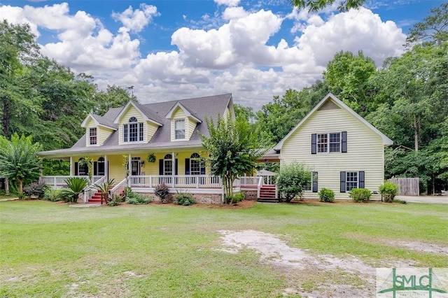 view of front of home featuring covered porch and a front yard