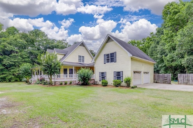 view of front of house with a porch, a garage, and a front yard