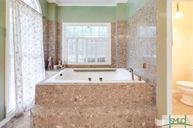 bathroom featuring toilet, crown molding, and tiled tub