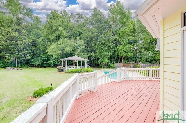 wooden deck with a gazebo and a yard