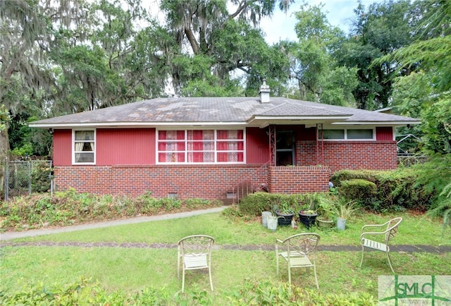 ranch-style house with a front yard