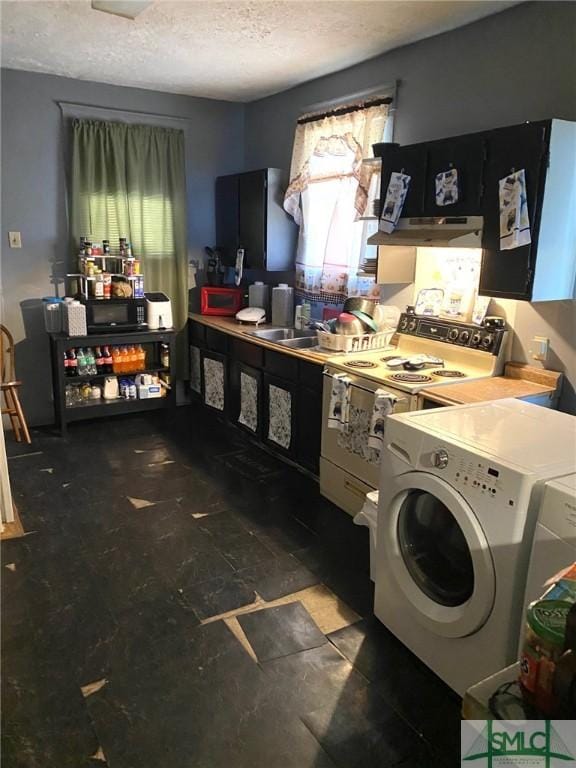 kitchen with washer and dryer, a textured ceiling, and white range with electric stovetop