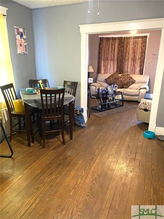 dining area with hardwood / wood-style flooring