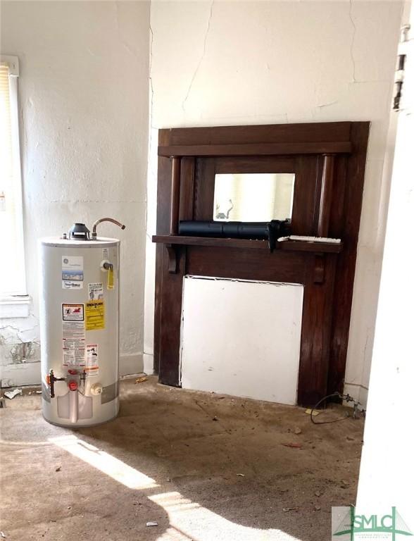 utility room with gas water heater