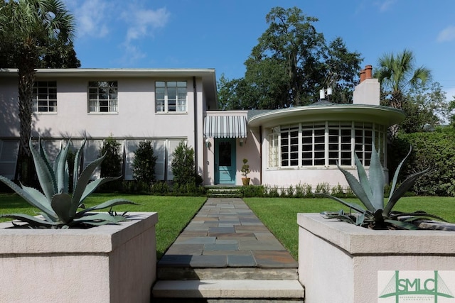 view of front of home with a front yard