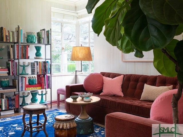 sitting room featuring plenty of natural light and wood-type flooring