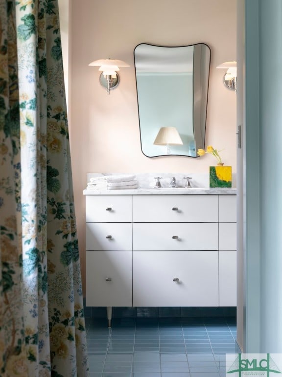 bathroom featuring tile flooring and vanity