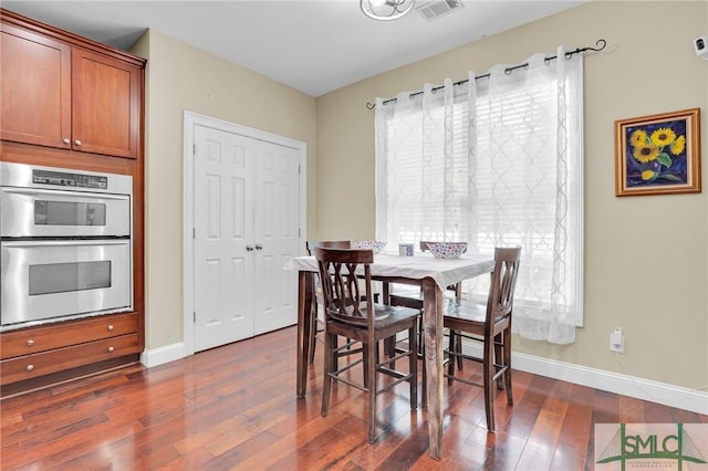 dining room featuring dark wood-type flooring