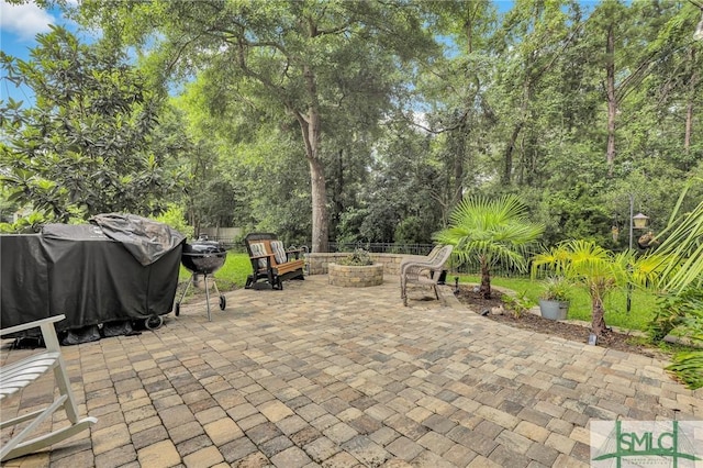 view of patio with grilling area and an outdoor fire pit