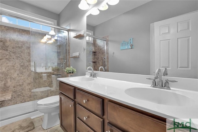 bathroom with walk in shower, tile patterned floors, vanity, and toilet