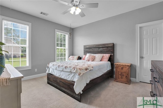 carpeted bedroom with ceiling fan