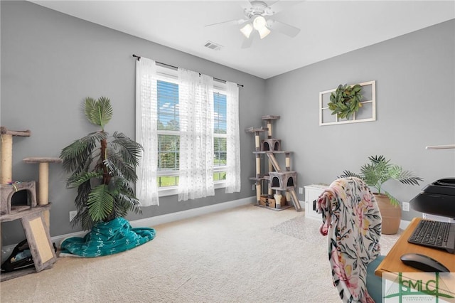 carpeted office with ceiling fan