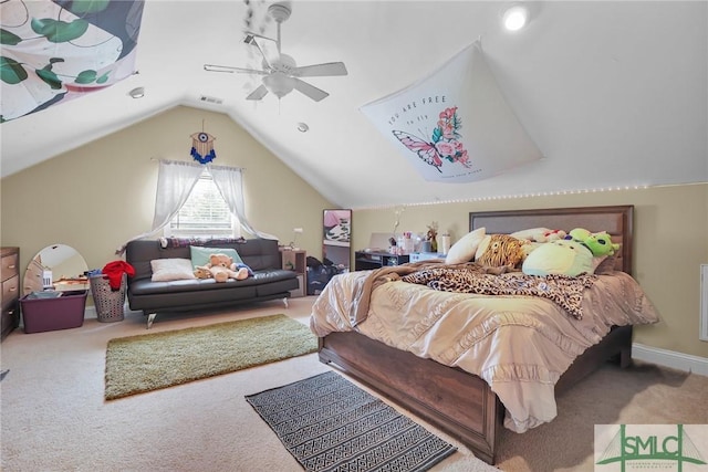 carpeted bedroom with ceiling fan and vaulted ceiling