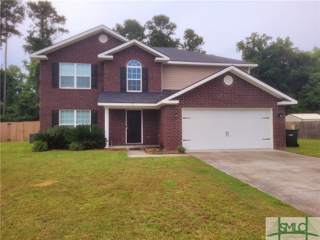 view of front of house with a garage and a front lawn