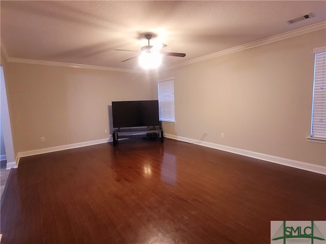 unfurnished living room with dark wood-type flooring, crown molding, and ceiling fan