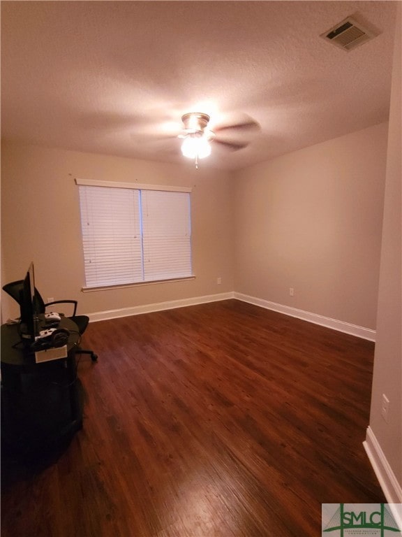 interior space featuring dark hardwood / wood-style flooring and ceiling fan