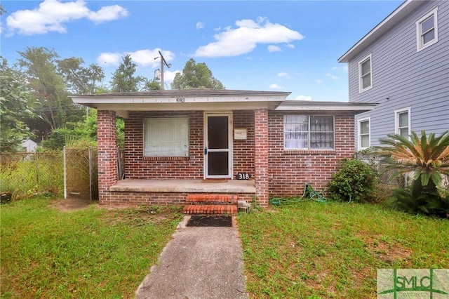 view of front of home with a front yard