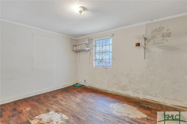 unfurnished room featuring dark hardwood / wood-style flooring and crown molding