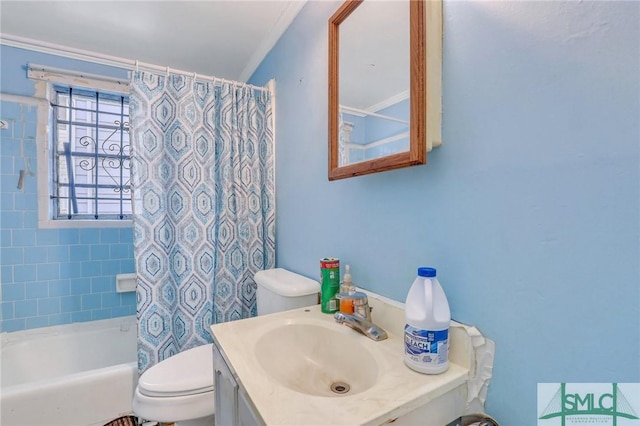 full bathroom featuring vanity, toilet, ornamental molding, and shower / tub combo