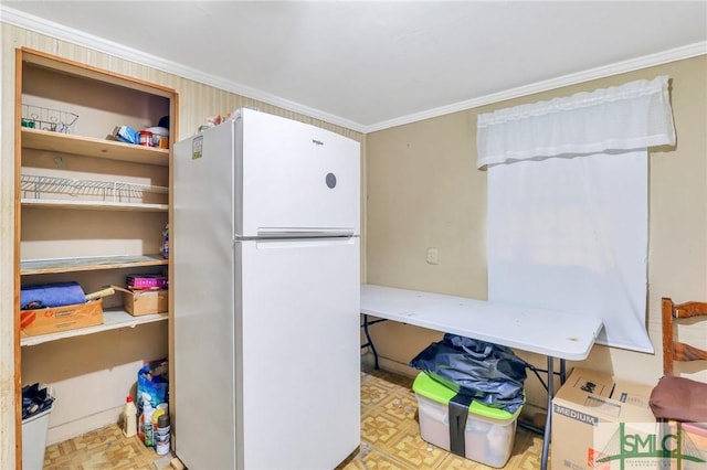 interior space with white fridge and crown molding