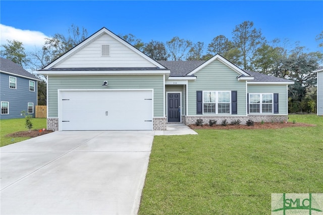 view of front of house with a front lawn and a garage