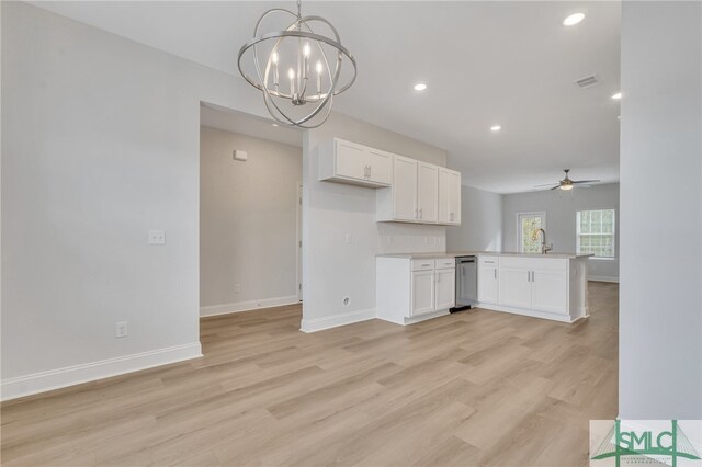 kitchen featuring pendant lighting, white cabinetry, kitchen peninsula, and light wood-type flooring