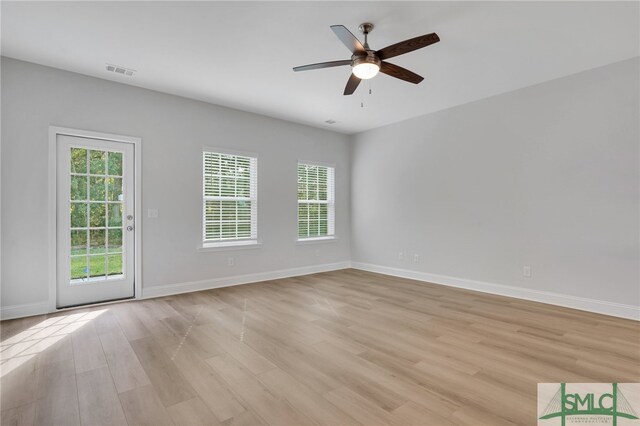 unfurnished room featuring light wood-type flooring and ceiling fan