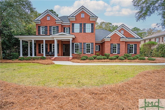 view of front of property with a porch and a front yard