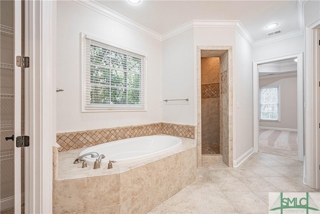 bathroom with ornamental molding and shower with separate bathtub