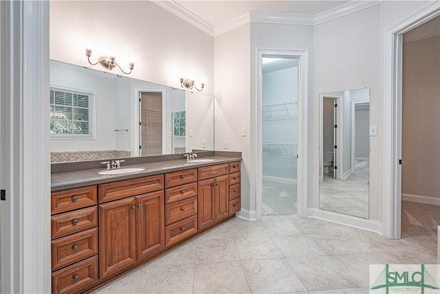 bathroom featuring vanity, tile patterned floors, and ornamental molding